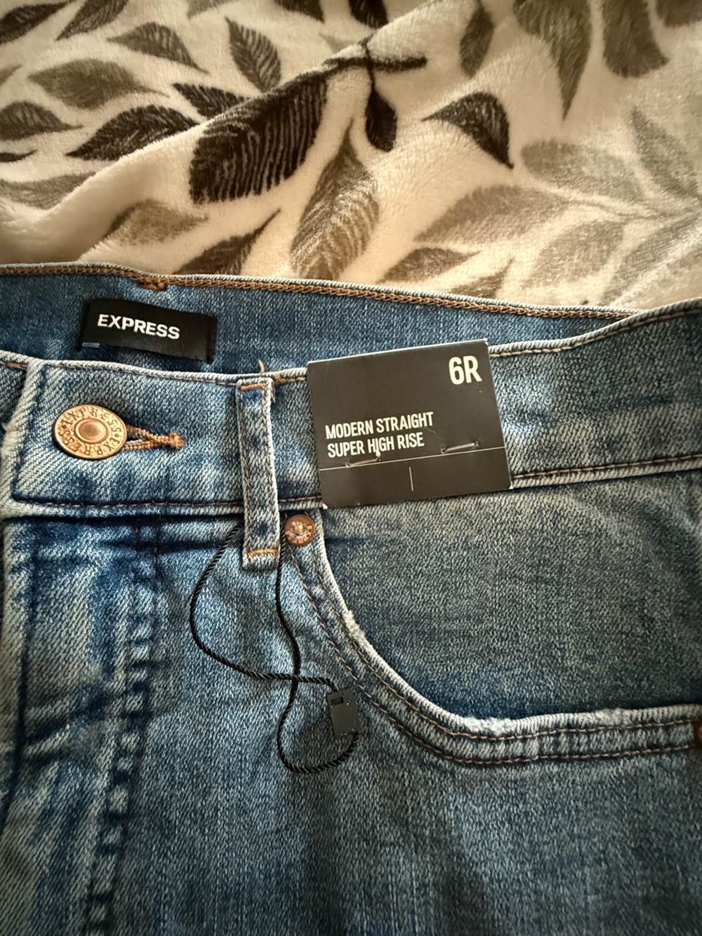 Express Women's Flare Jeans in Medium Blue with Distressed Details